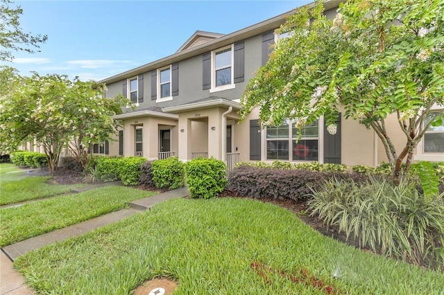 1866 Red Canyon Dr, Kissimmee, FL 34744 - multi unit property with stucco siding and a front lawn