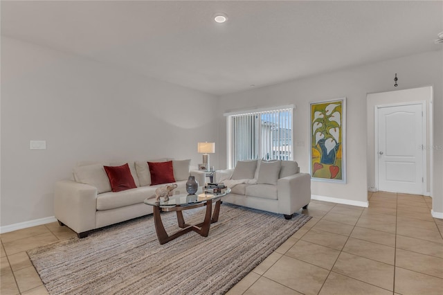 1866 Red Canyon Dr, Kissimmee, FL 34744 - living room featuring light tile patterned floors and baseboards