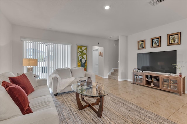 1866 Red Canyon Dr, Kissimmee, FL 34744 - living area with light tile patterned flooring, stairway, and recessed lighting