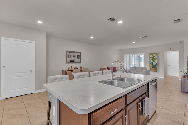 1866 Red Canyon Dr, Kissimmee, FL 34744 - kitchen with light tile patterned flooring, open floor plan, stainless steel dishwasher, light countertops, and recessed lighting