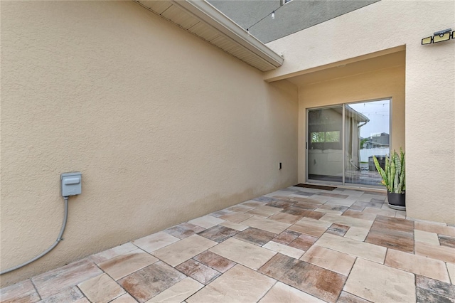 1866 Red Canyon Dr, Kissimmee, FL 34744 - doorway to property with a patio and stucco siding