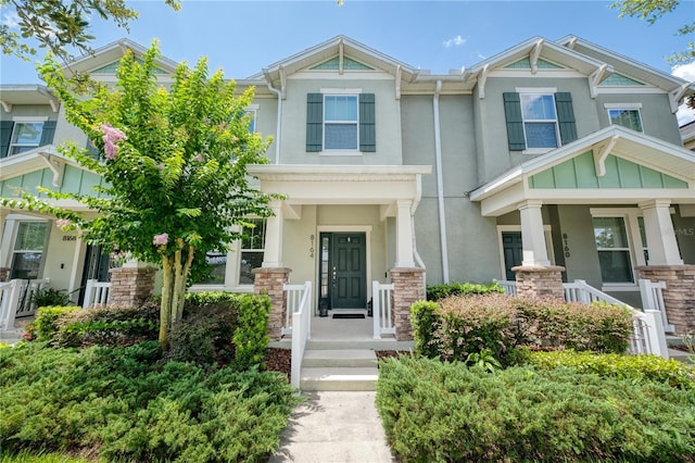 8164 Wood Sage Dr, Winter Garden, FL 34787 - view of front of home with stucco siding and stone siding