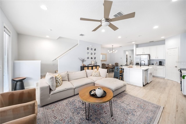 8164 Wood Sage Dr, Winter Garden, FL 34787 - living room featuring ceiling fan, a chandelier, light wood finished floors, and recessed lighting