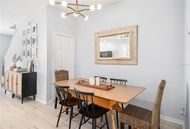 8164 Wood Sage Dr, Winter Garden, FL 34787 - dining room with a chandelier and light wood-type flooring