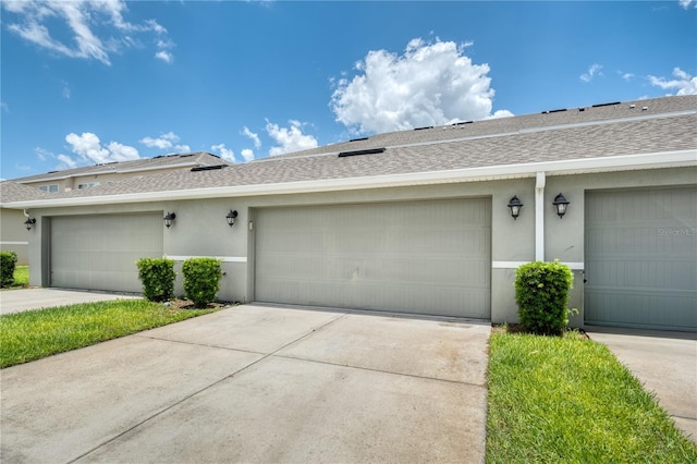 8164 Wood Sage Dr, Winter Garden, FL 34787 - view of front facade featuring stucco siding and a shingled roof
