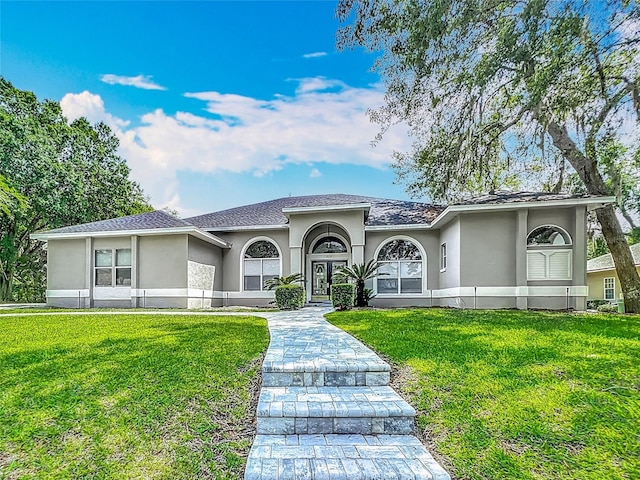 704 Forest View Ct, Winter Springs, FL 32708 - view of front facade with stucco siding and a front lawn