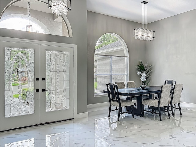 704 Forest View Ct, Winter Springs, FL 32708 - foyer with a chandelier, marble tiled floors, and french doors