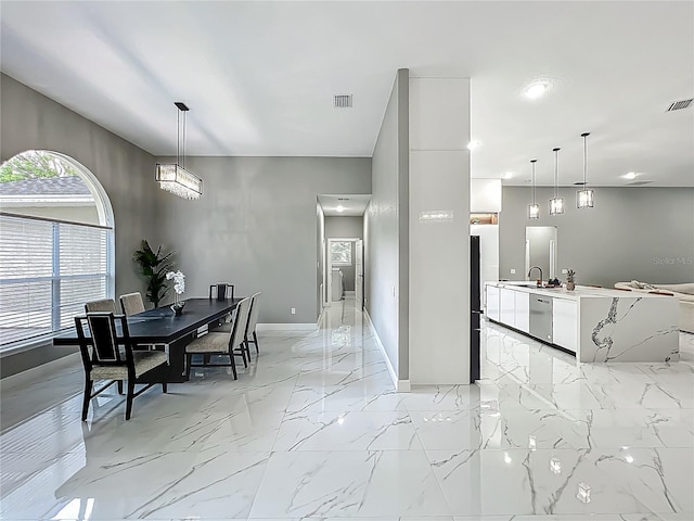 704 Forest View Ct, Winter Springs, FL 32708 - dining area featuring light marble finish floors and recessed lighting