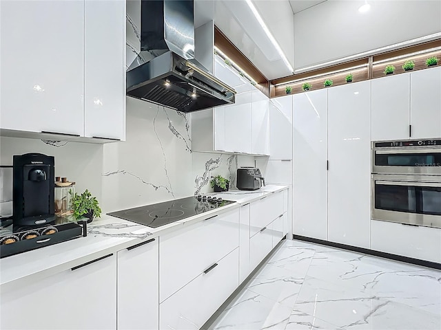 704 Forest View Ct, Winter Springs, FL 32708 - kitchen with wall chimney exhaust hood, stainless steel double oven, modern cabinets, black electric stovetop, and white cabinetry