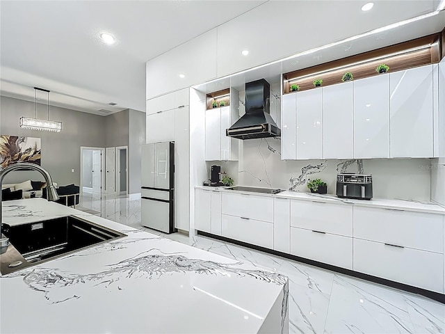704 Forest View Ct, Winter Springs, FL 32708 - kitchen featuring wall chimney exhaust hood, freestanding refrigerator, light marble finish flooring, modern cabinets, and recessed lighting