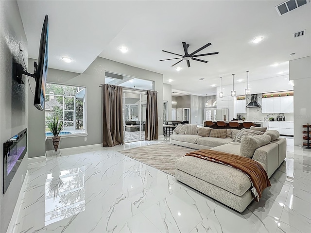 704 Forest View Ct, Winter Springs, FL 32708 - living room featuring ceiling fan, recessed lighting, and light marble finish floors