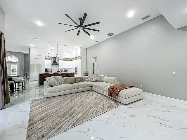 704 Forest View Ct, Winter Springs, FL 32708 - living room featuring a ceiling fan, light marble finish flooring, and recessed lighting