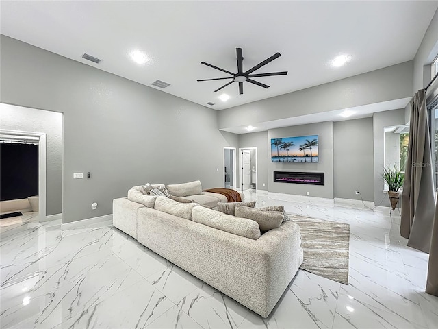 704 Forest View Ct, Winter Springs, FL 32708 - living area featuring ceiling fan, light marble finish floors, a glass covered fireplace, and recessed lighting
