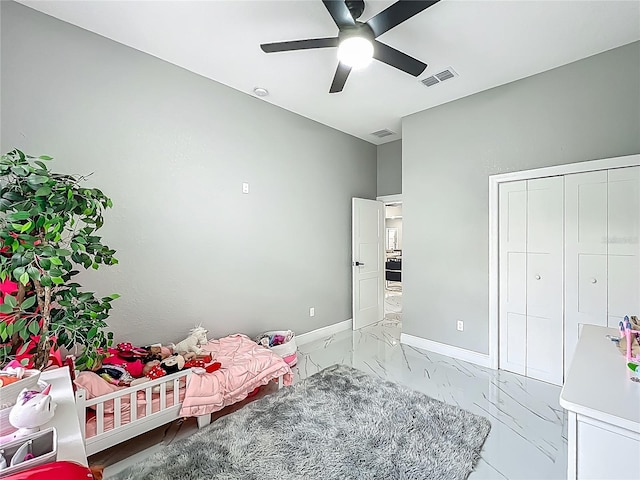 704 Forest View Ct, Winter Springs, FL 32708 - bedroom featuring light marble finish flooring, a ceiling fan, and a closet