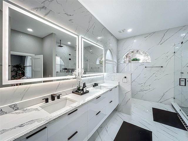 704 Forest View Ct, Winter Springs, FL 32708 - full bath featuring a marble finish shower, double vanity, marble tiled flooring, recessed lighting, and stone wall