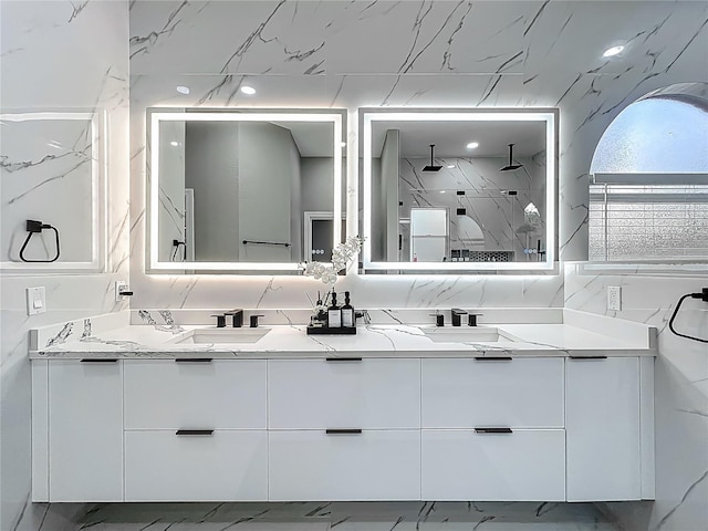 704 Forest View Ct, Winter Springs, FL 32708 - bathroom with marble finish flooring, double vanity, and a marble finish shower