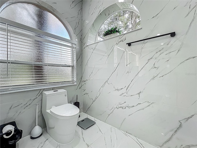 704 Forest View Ct, Winter Springs, FL 32708 - bathroom with marble look tile flooring and toilet