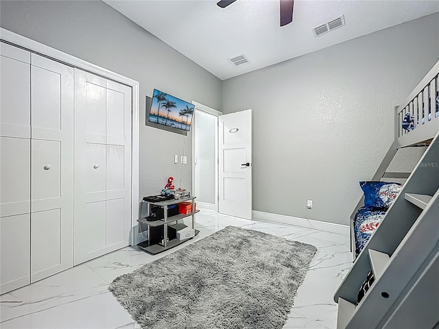 704 Forest View Ct, Winter Springs, FL 32708 - bedroom with light marble finish floors, a closet, and a ceiling fan