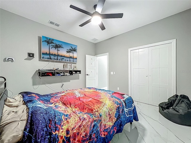 704 Forest View Ct, Winter Springs, FL 32708 - bedroom featuring marble look tile flooring, a ceiling fan, and a closet