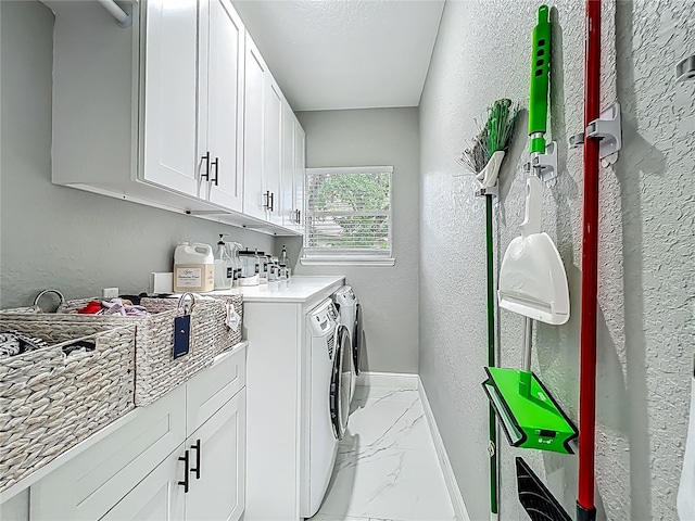 704 Forest View Ct, Winter Springs, FL 32708 - washroom with light marble finish floors, washing machine and dryer, and a textured wall