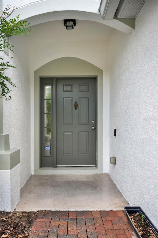 6931 Sperone St, Orlando, FL 32819 - view of exterior entry with stucco siding