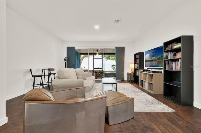 6931 Sperone St, Orlando, FL 32819 - living room featuring wood finished floors