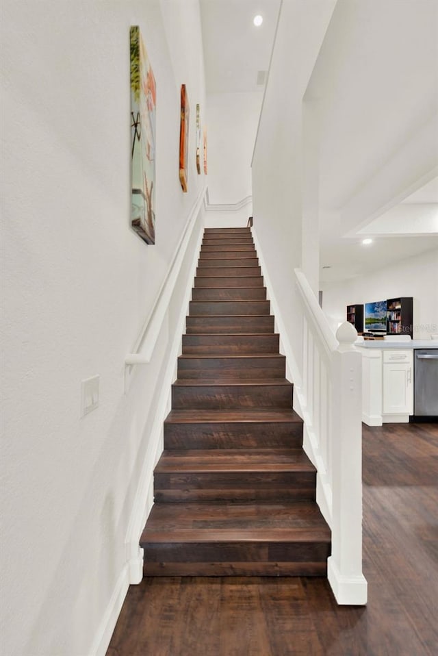 6931 Sperone St, Orlando, FL 32819 - stairway featuring wood finished floors and recessed lighting
