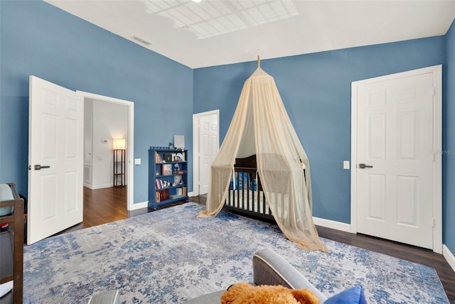 6931 Sperone St, Orlando, FL 32819 - bedroom featuring wood finished floors and baseboards