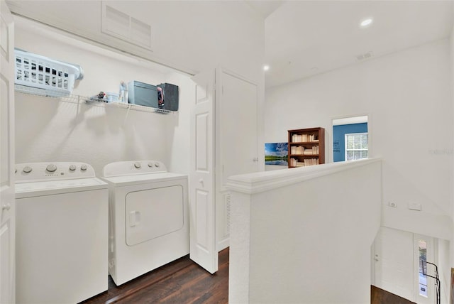 6931 Sperone St, Orlando, FL 32819 - laundry room with washer and dryer, dark wood-type flooring, and recessed lighting
