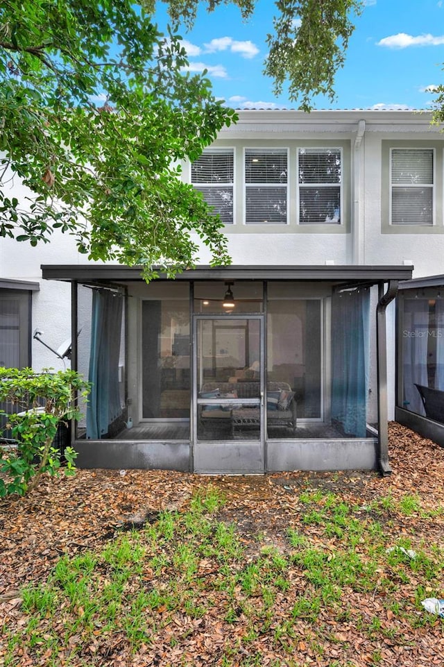 6931 Sperone St, Orlando, FL 32819 - back of house with a sunroom