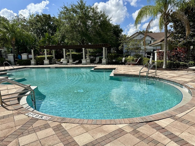 6931 Sperone St, Orlando, FL 32819 - community pool featuring a patio and a pergola