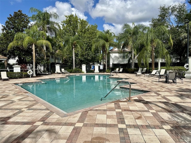 6931 Sperone St, Orlando, FL 32819 - community pool featuring a patio
