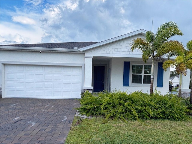 6300 Chirpine Ln, Saint Cloud, FL 34771 - view of front of house featuring stucco siding, driveway, and a garage