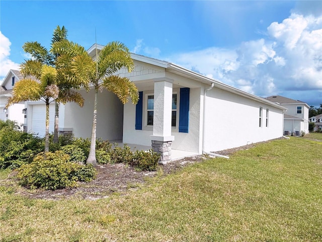 6300 Chirpine Ln, Saint Cloud, FL 34771 - view of property exterior with stucco siding and a yard