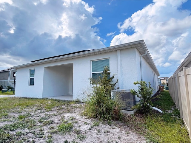 6300 Chirpine Ln, Saint Cloud, FL 34771 - view of property exterior with stucco siding