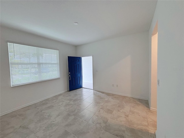 6300 Chirpine Ln, Saint Cloud, FL 34771 - unfurnished room with baseboards and light tile patterned floors