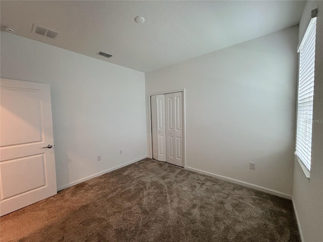 6300 Chirpine Ln, Saint Cloud, FL 34771 - unfurnished bedroom with carpet flooring and a closet