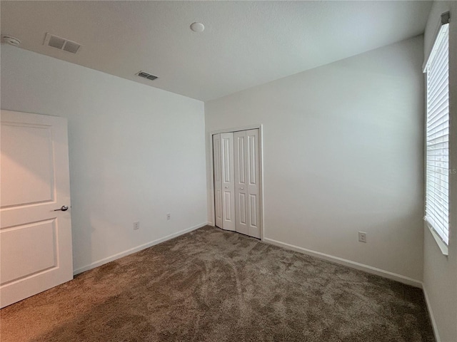 6300 Chirpine Ln, Saint Cloud, FL 34771 - unfurnished bedroom with carpet and a closet