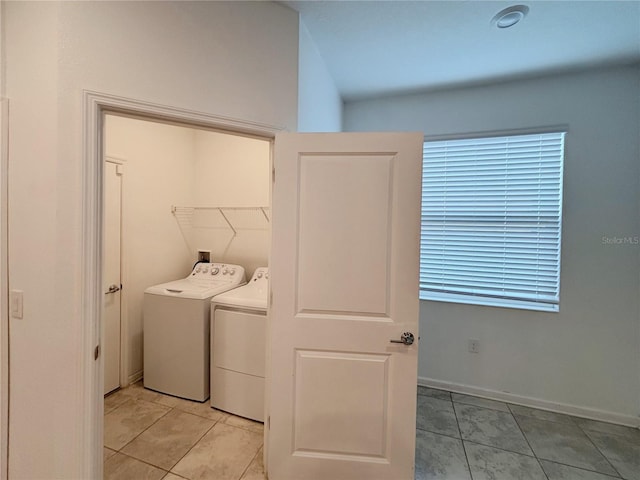 6300 Chirpine Ln, Saint Cloud, FL 34771 - laundry room with washer and clothes dryer and light tile patterned floors