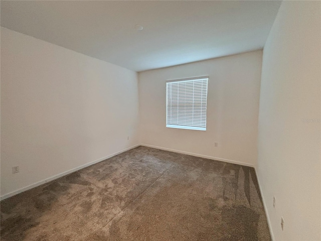 6300 Chirpine Ln, Saint Cloud, FL 34771 - carpeted empty room featuring baseboards