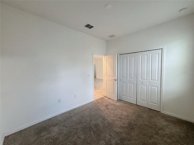 6300 Chirpine Ln, Saint Cloud, FL 34771 - unfurnished bedroom with carpet floors and a closet