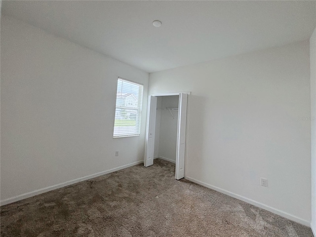 6300 Chirpine Ln, Saint Cloud, FL 34771 - unfurnished bedroom with carpet floors and a closet