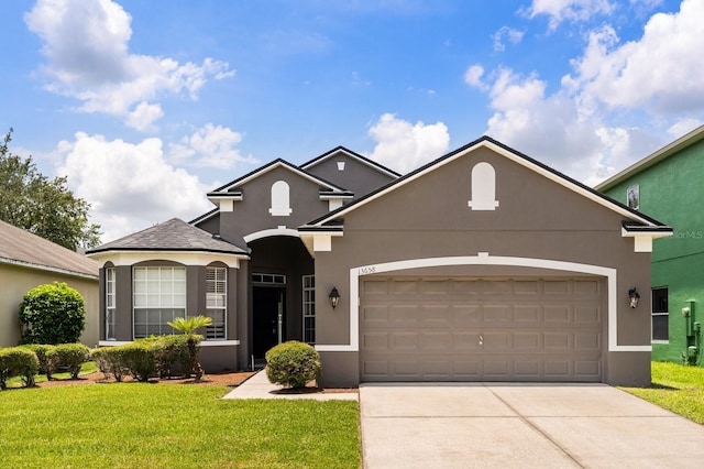 13658 Hidden Forest Cir, Orlando, FL 32828 - traditional home with stucco siding, a front yard, concrete driveway, and an attached garage