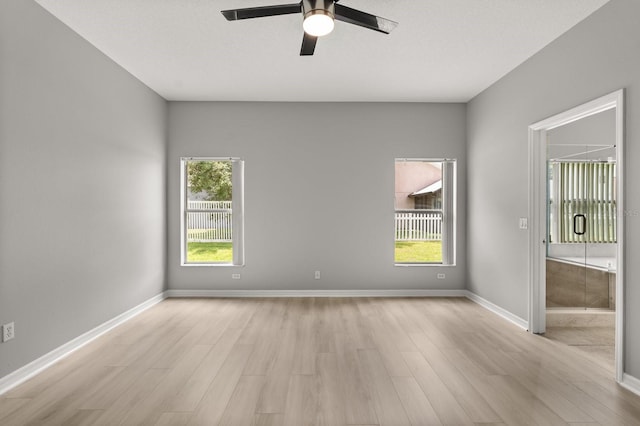 13658 Hidden Forest Cir, Orlando, FL 32828 - empty room with a ceiling fan and light wood-type flooring