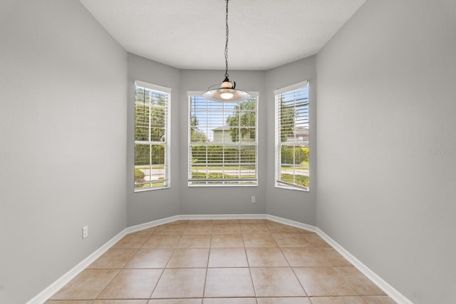 13658 Hidden Forest Cir, Orlando, FL 32828 - unfurnished dining area with healthy amount of natural light and light tile patterned floors
