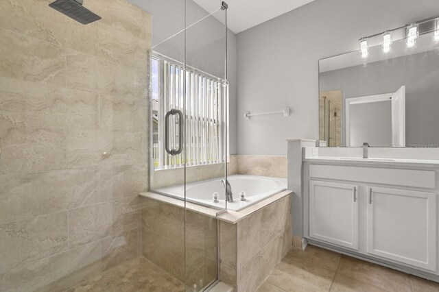 13658 Hidden Forest Cir, Orlando, FL 32828 - bathroom featuring a shower stall, vanity, a garden tub, and tile patterned floors
