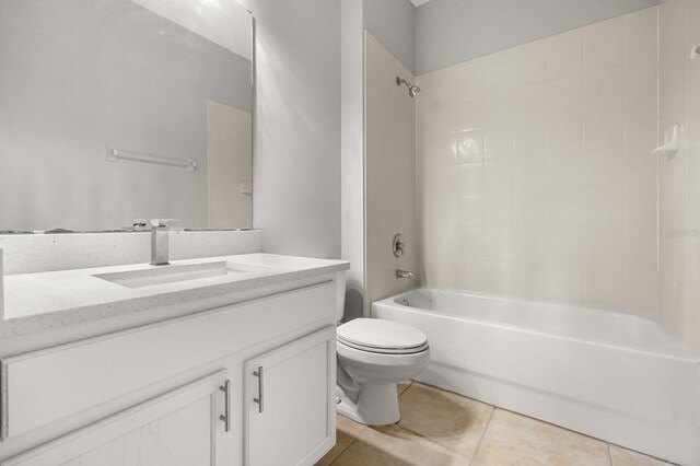 13658 Hidden Forest Cir, Orlando, FL 32828 - full bath featuring vanity, tile patterned floors, and washtub / shower combination