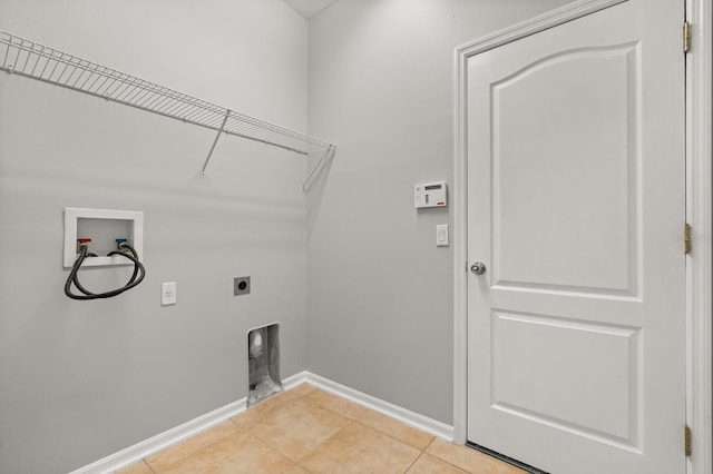 13658 Hidden Forest Cir, Orlando, FL 32828 - laundry area with hookup for an electric dryer, washer hookup, and light tile patterned floors