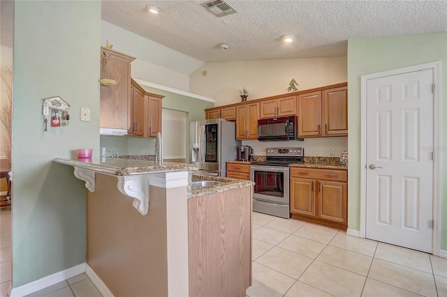 2800 Woodsmere Ct, Kissimmee, FL 34746 - kitchen featuring stainless steel appliances, a peninsula, light tile patterned flooring, a breakfast bar, and lofted ceiling