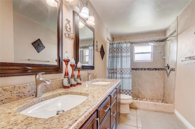 2800 Woodsmere Ct, Kissimmee, FL 34746 - bathroom with a tile shower, double vanity, and tile patterned floors